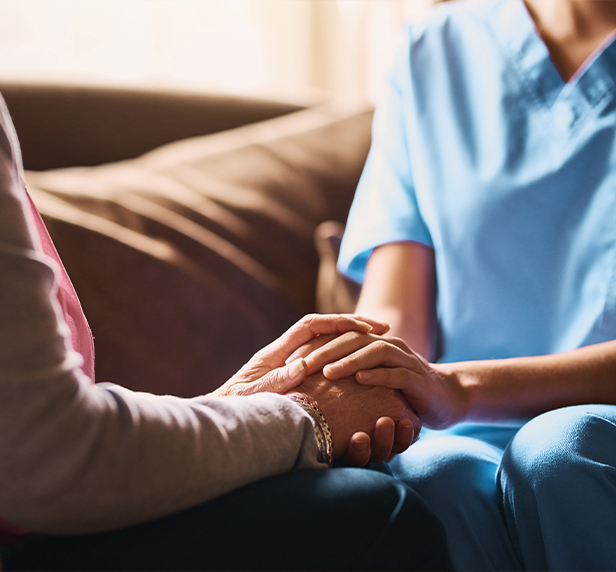 Medical, support and holding hands with nurse and old woman