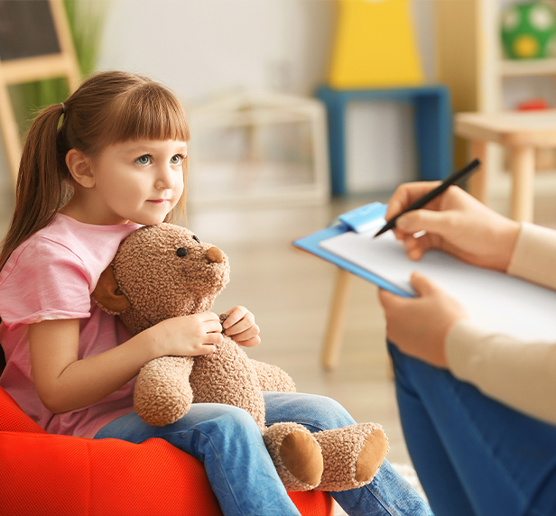 Cute little girl at child psychologist's office